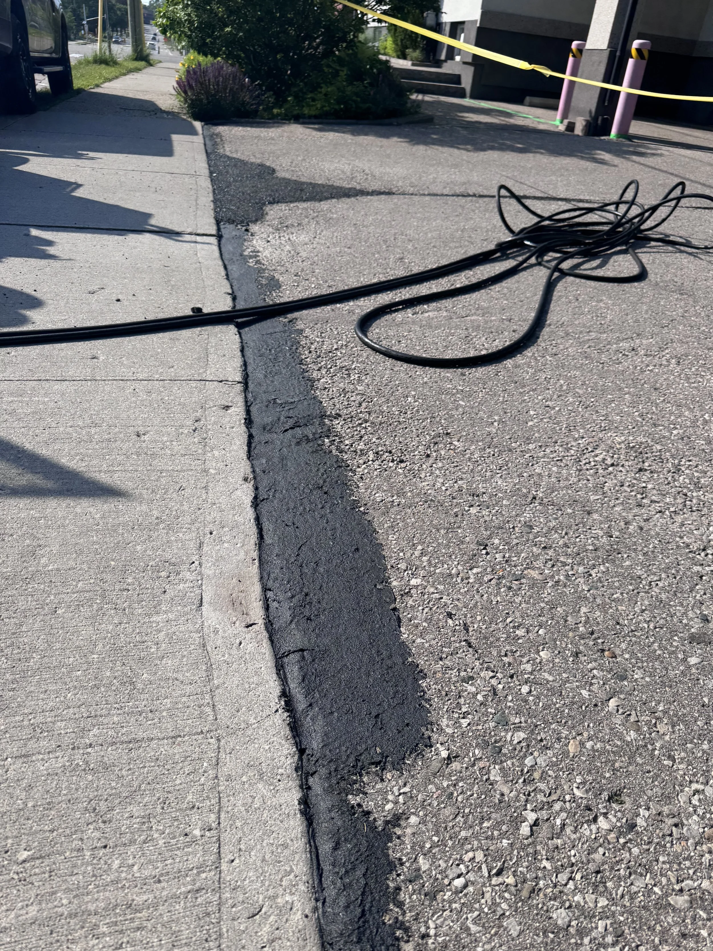 An image of asphalt levelling in a business parking lot