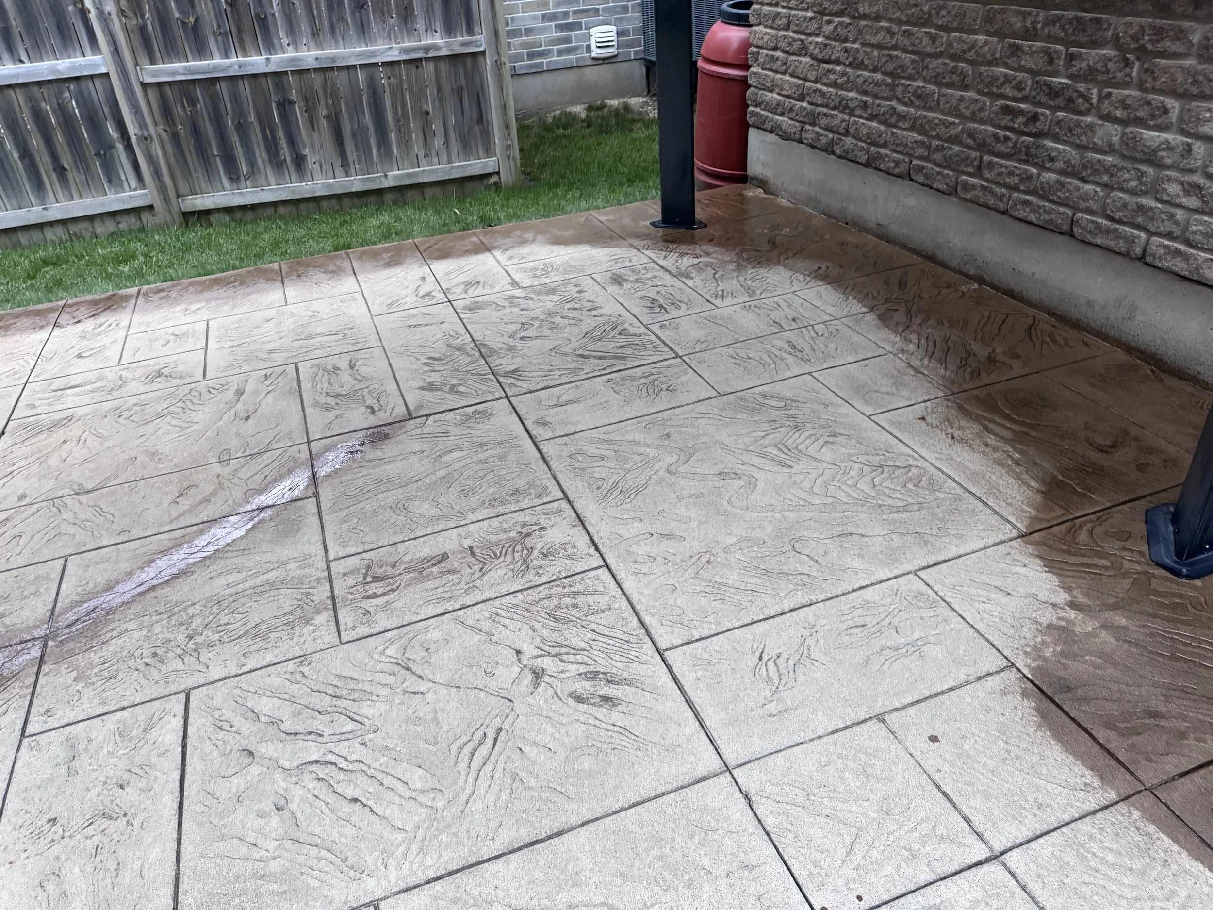 Stamped concrete patio tiles after concrete sealing, wet finish, Kitchener