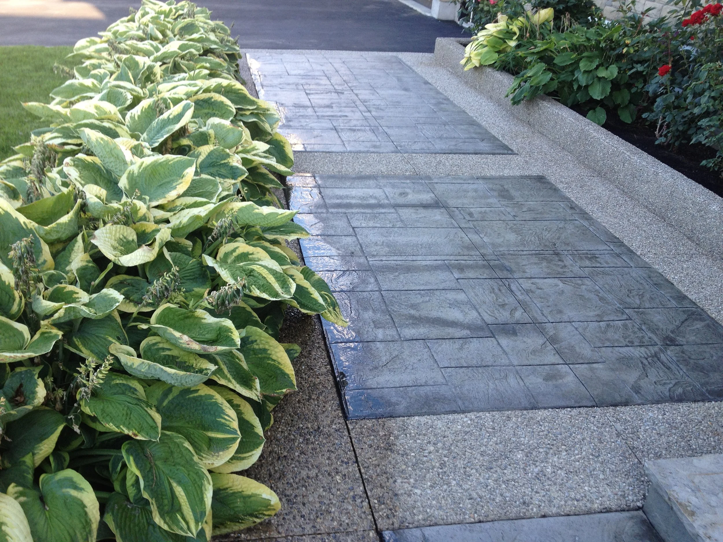 Stone tile pathway after concrete sealing, wet finish, Guelph