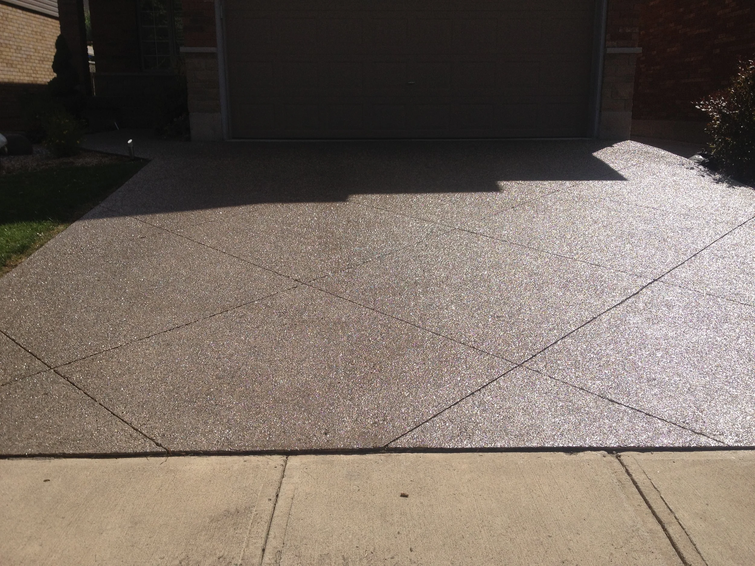 Aggregate concrete driveway after concrete sealing, Cambridge