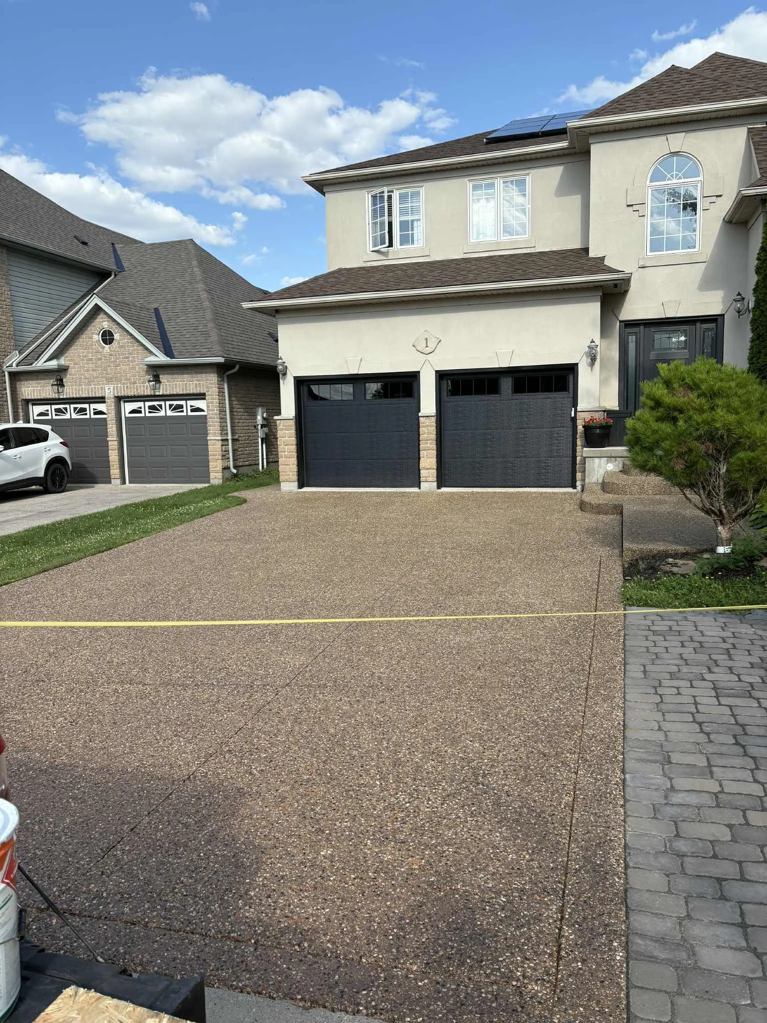 Aggregate pebble driveway after concrete sealing final inspection, Cambridge